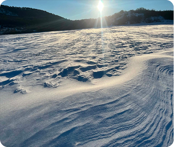 Snowy sunlit hills