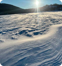 Snowy sunlit hills
